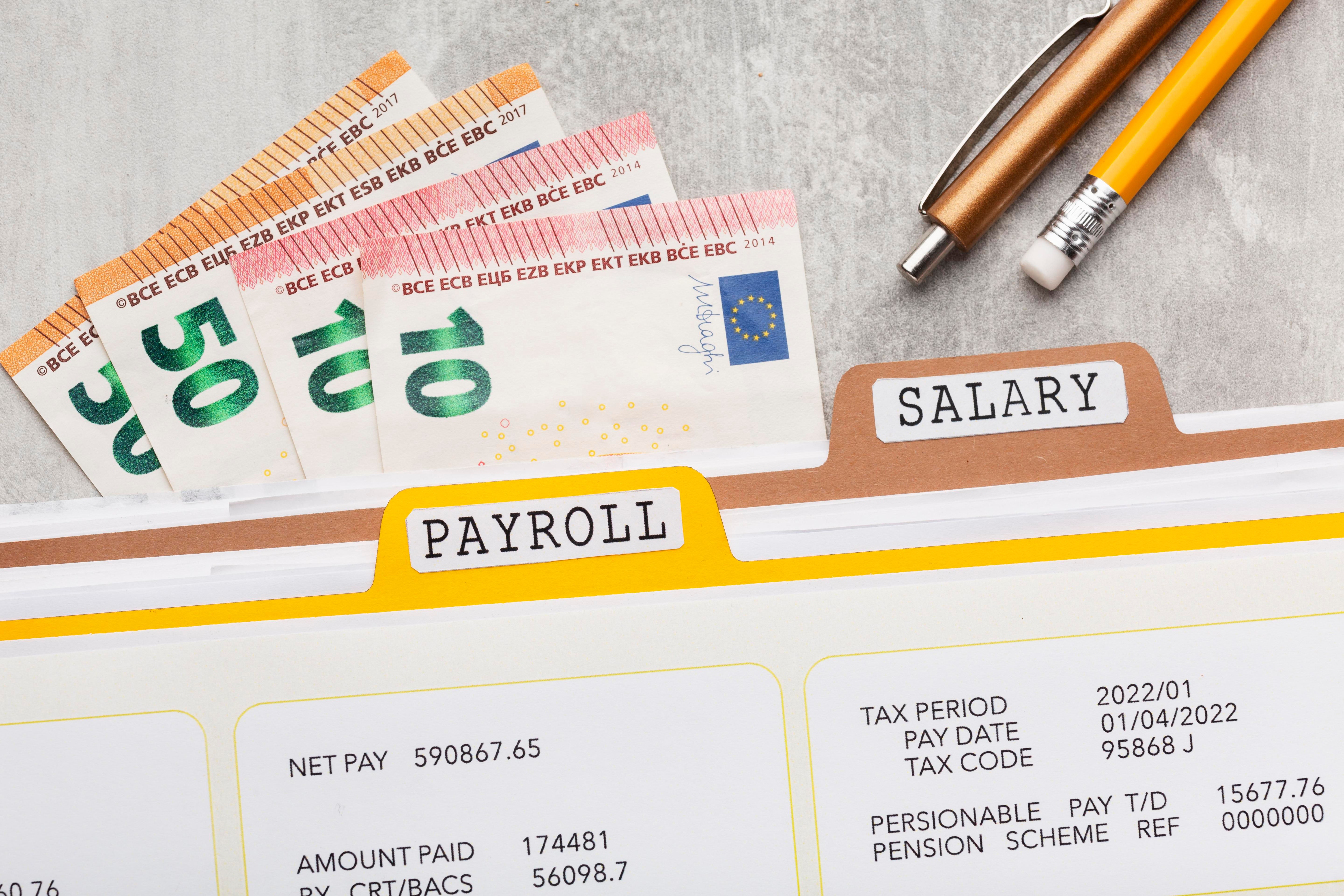 top-view-payroll-concept-with-money.jpg
